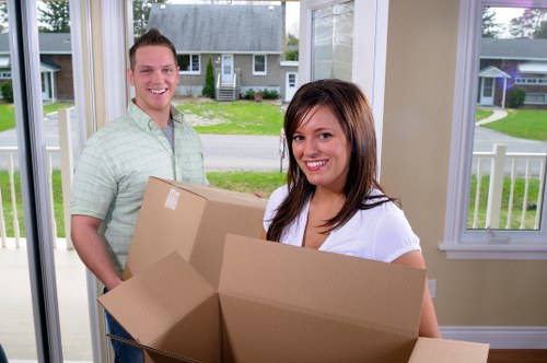 Local moving van helping with furniture transport in Sutton