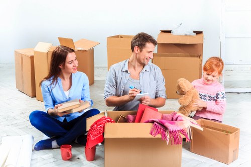 Office relocation team planning a move in Sutton with boxes and desks