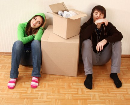 Moving team unloading belongings at a Sutton property