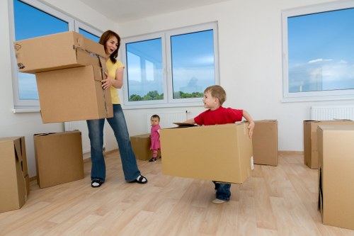 Moving boxes and household items with a van in Sutton