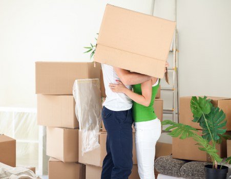 Packing boxes and loading a moving van in Sutton