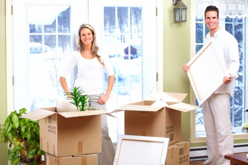 Professional movers loading a van for a Sutton relocation